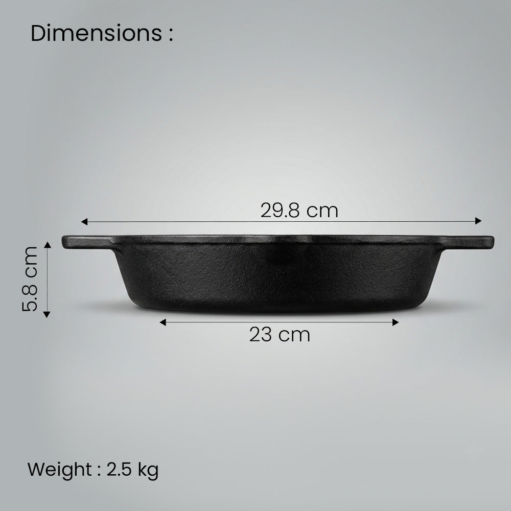 A black cast iron skillet with handle dimensions labeled on a light gray background, with text showing width measurements of 29.8 cm and 23 cm, and height of 5.