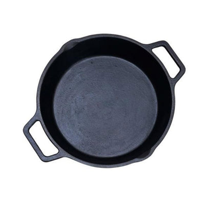 A classic black cast iron skillet with two side handles, photographed from a top-down perspective on a solid white background.